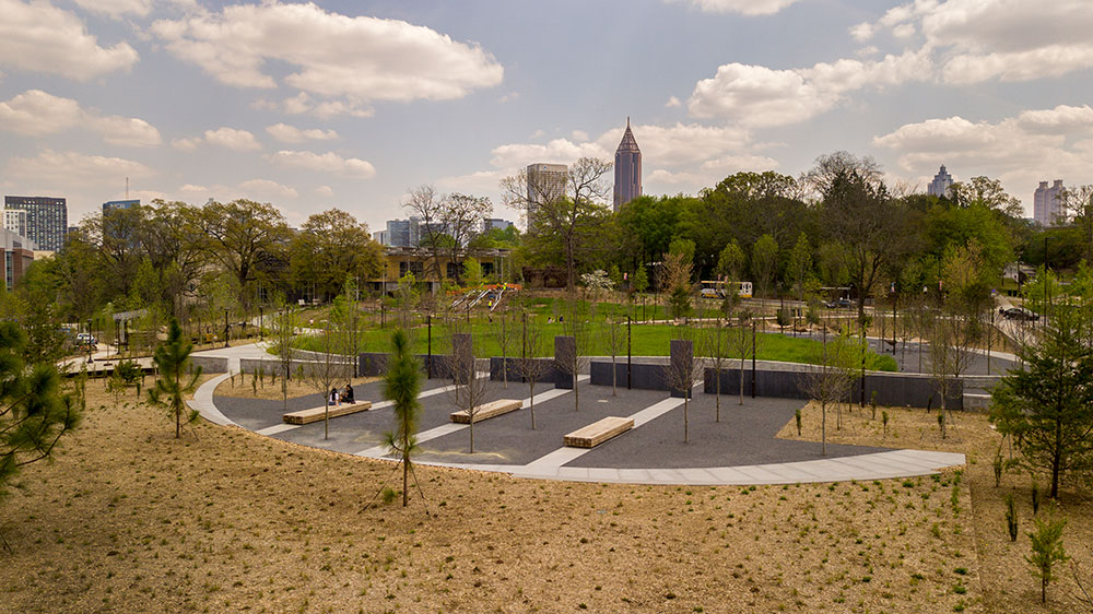 Landscape view of Eco Commons with Atlanta skyline in the background.