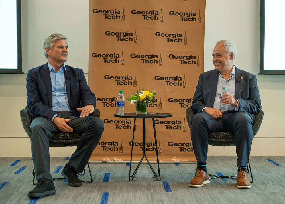 Steve Case and President Ángel Cabrera sitting in two chairs.