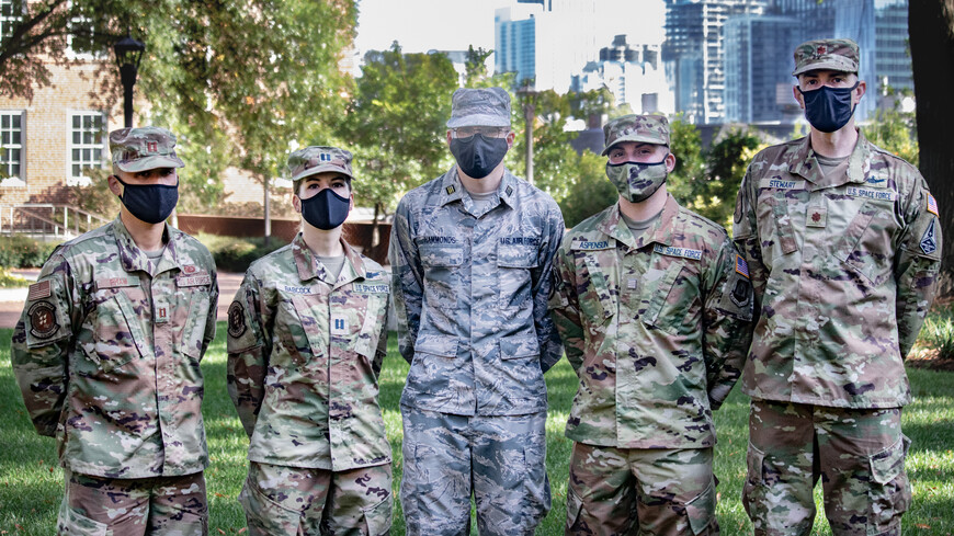 Space Force officers wearing face masks standing in a row outside.